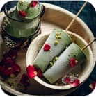 ice cream on a stick on a wooden tray